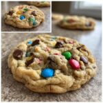 Close-up of a delicious M&M chocolate chip cookie with colorful candies and chocolate chips.